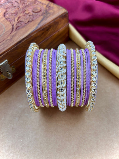 Ishhaara Lavender Embellished Silk Sari - A woman wearing a lavender sari with gold embroidery and traditional Indian jewelry - view 4