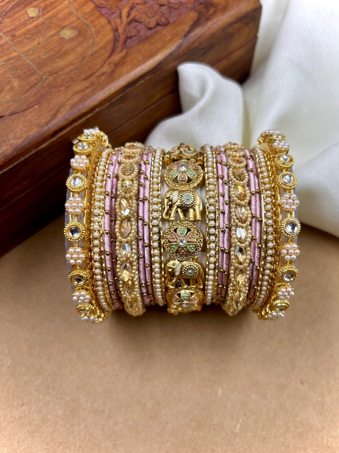 Ishhaara Luxurious Gold Kundan Bangle Set - A pair of intricately designed gold bangles with pink silk thread and rhinestones - view 2