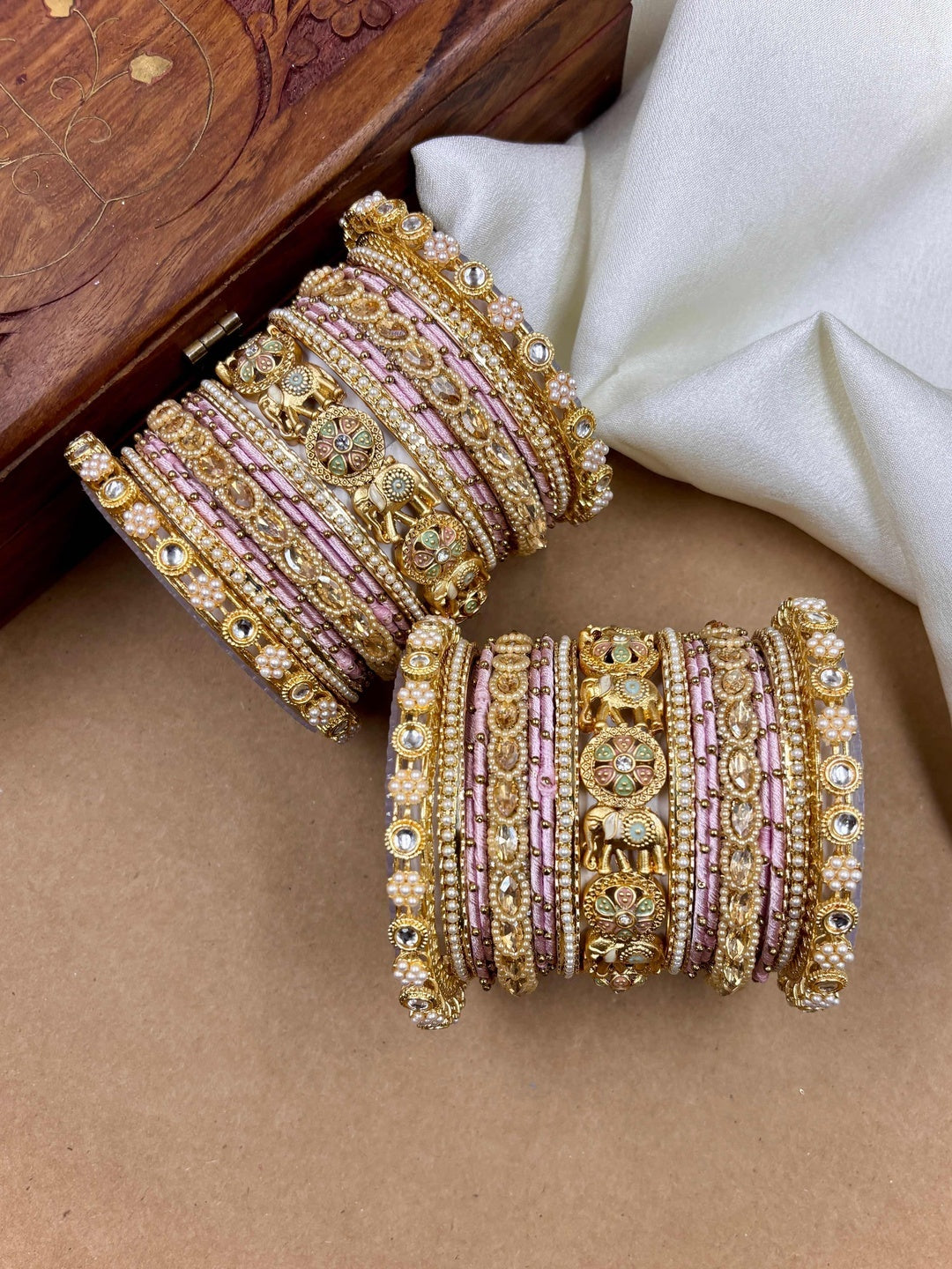 Ishhaara Luxurious Gold Kundan Bangle Set - A pair of intricately designed gold bangles with pink silk thread and rhinestones - view 3