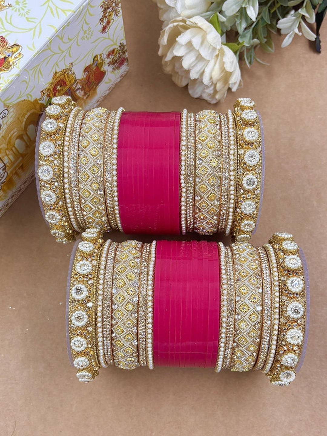 Ishhaara Luxury Pink Kundan Bangle Set - a stack of pink and gold bangles with intricate designs - view 2