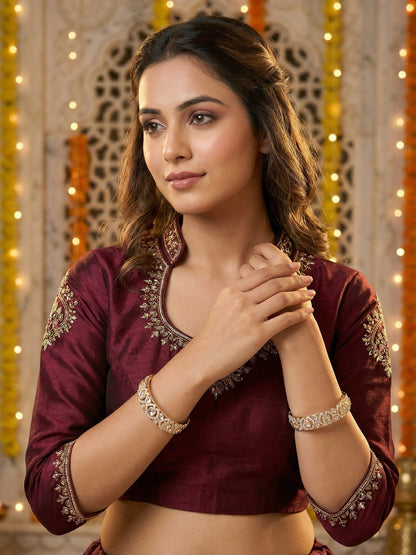 Ishhaara Maroon Embroidered Blouse - a woman wearing a maroon embroidered blouse