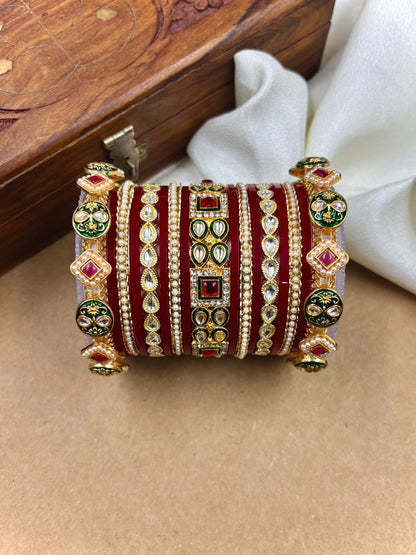 Ishhaara Maroon Kundan Bangle Set - a woman wearing a maroon top and gold kundan bangles - view 2