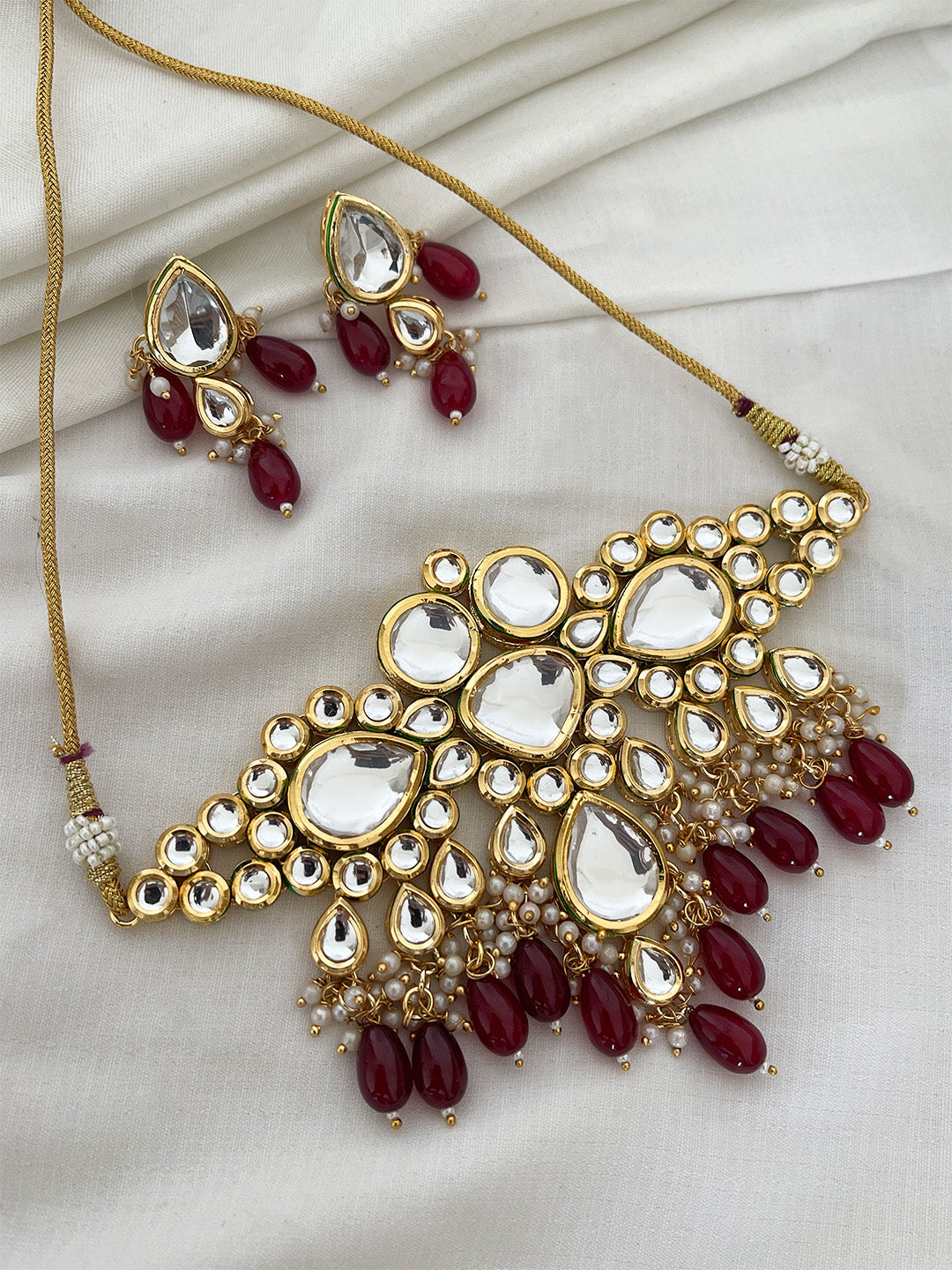 Ishhaara Maroon Kundan Studded And Beaded Jewellery Set