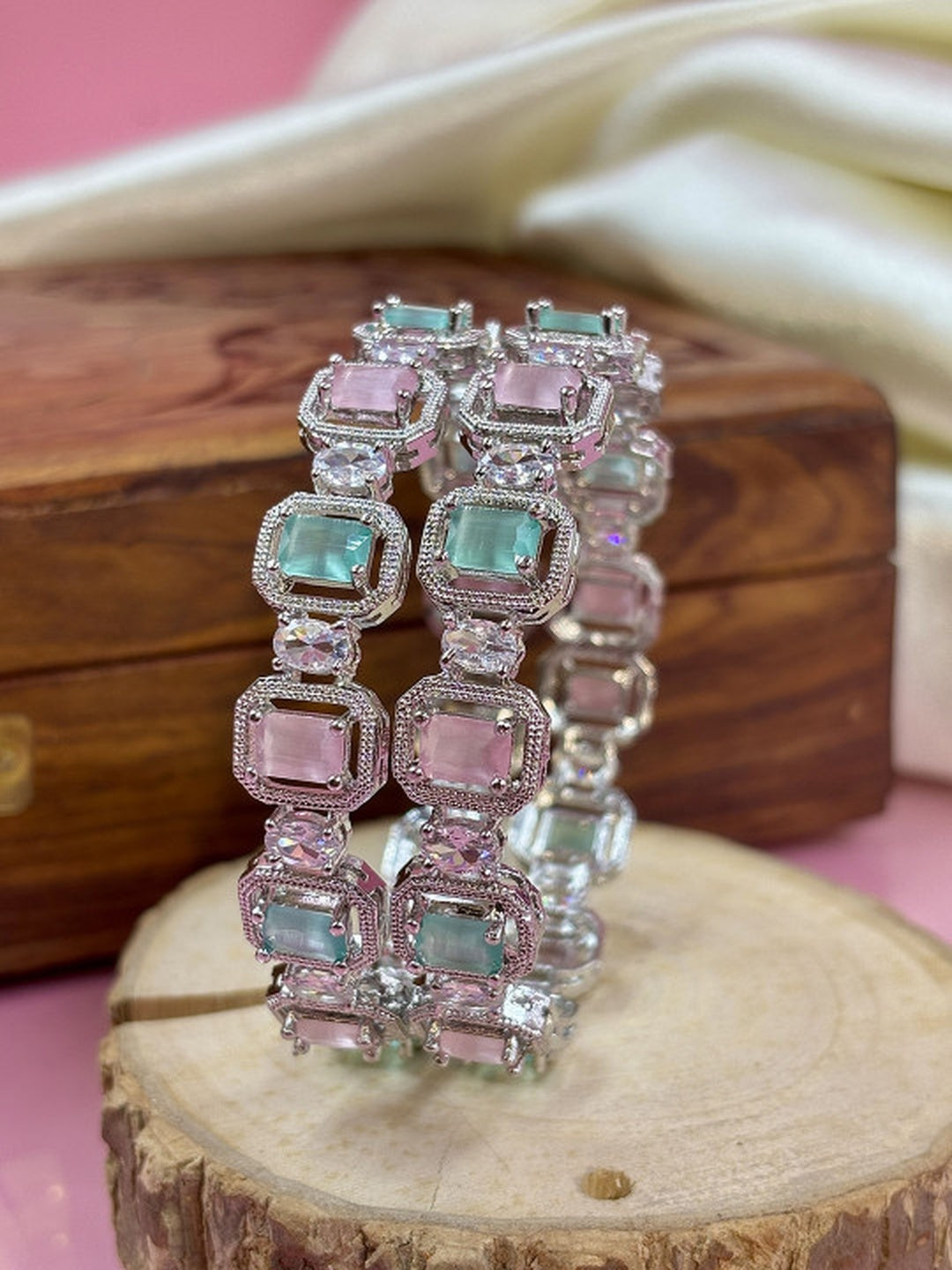 Ishhaara Multi Color CZ Kundan Bracelet - elegant silver bracelet with multi-color CZ stones on a wooden display - view 2