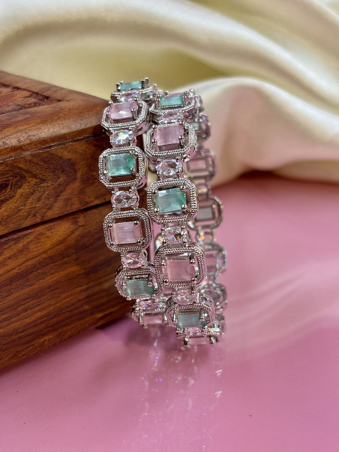 Ishhaara Multi Color CZ Kundan Bracelet - elegant silver bracelet with multi-color CZ stones on a wooden display - view 3