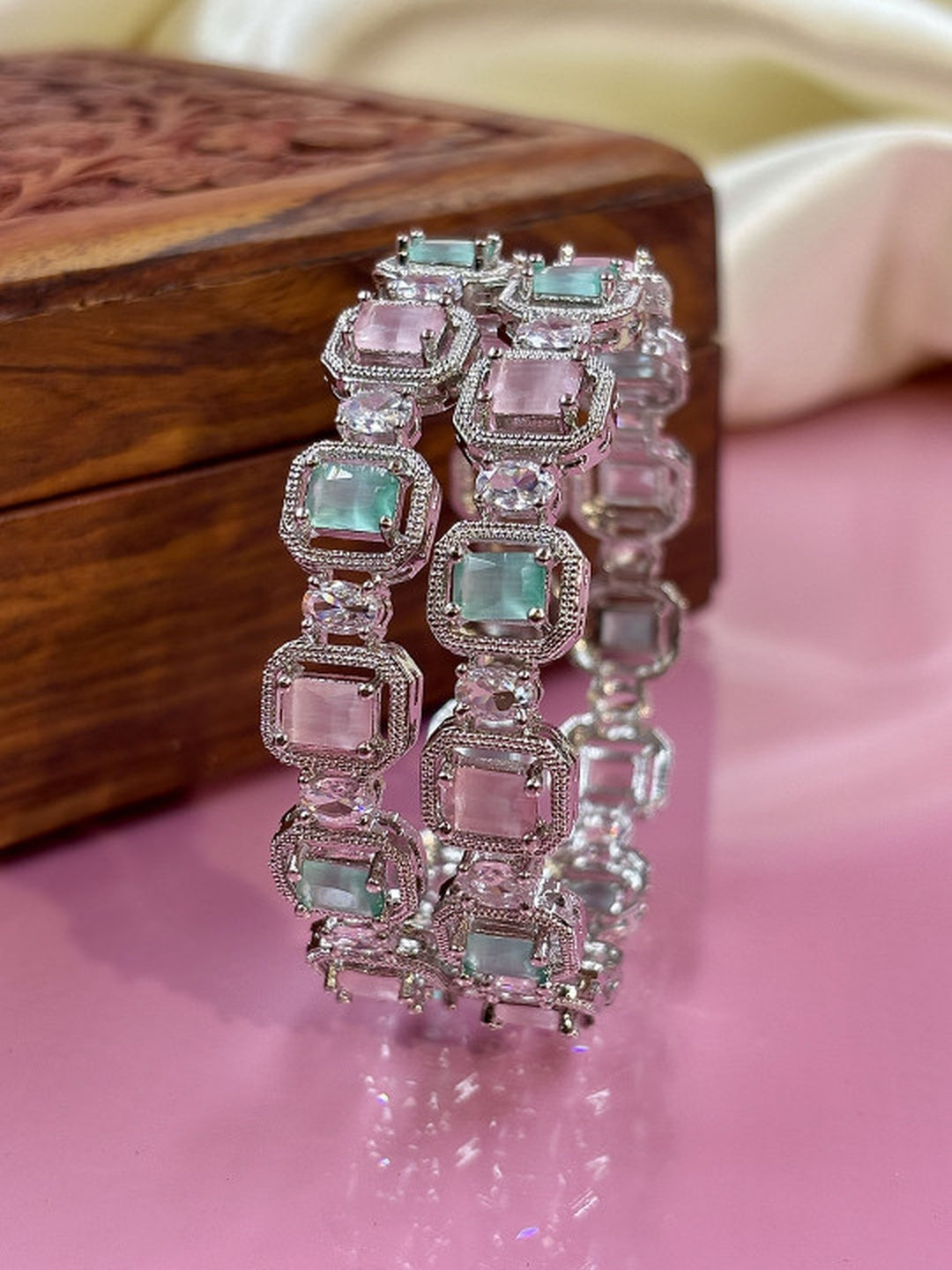 Ishhaara Multi Color CZ Kundan Bracelet - elegant silver bracelet with multi-color CZ stones on a wooden display - view 4
