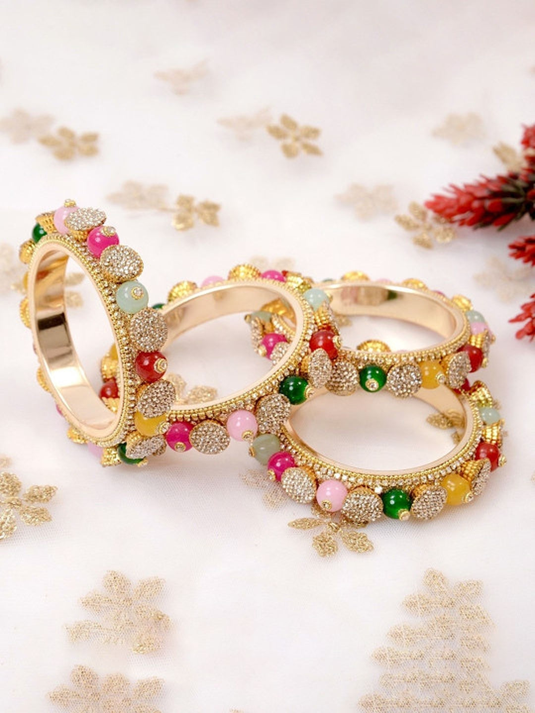 Ishhaara Multicolored Beaded Gold Bangle Set - a close-up view of beautifully crafted gold bangles with multicolored beads