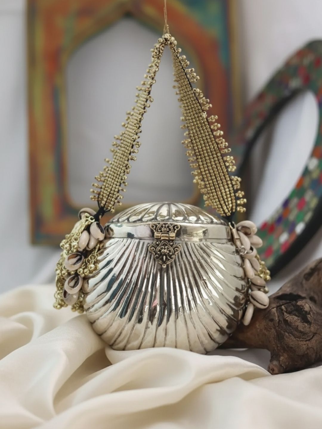 Ishhaara Oval Shaped Banjara Metal Clutch