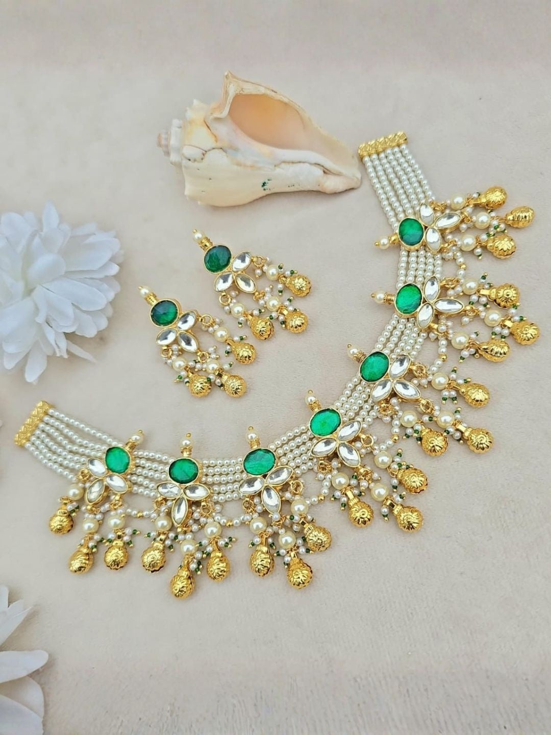 Ishhaara Pearl Choker with Emerald Flowers & Gold Tassels