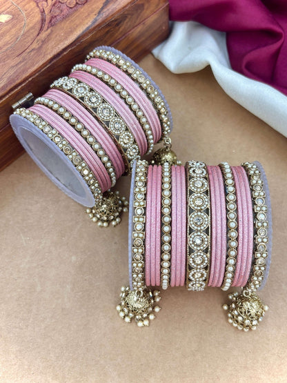 Ishhaara Pink Beaded Ethnic Bangle Set - A woman wearing a white top and pink beaded bangles - view 12