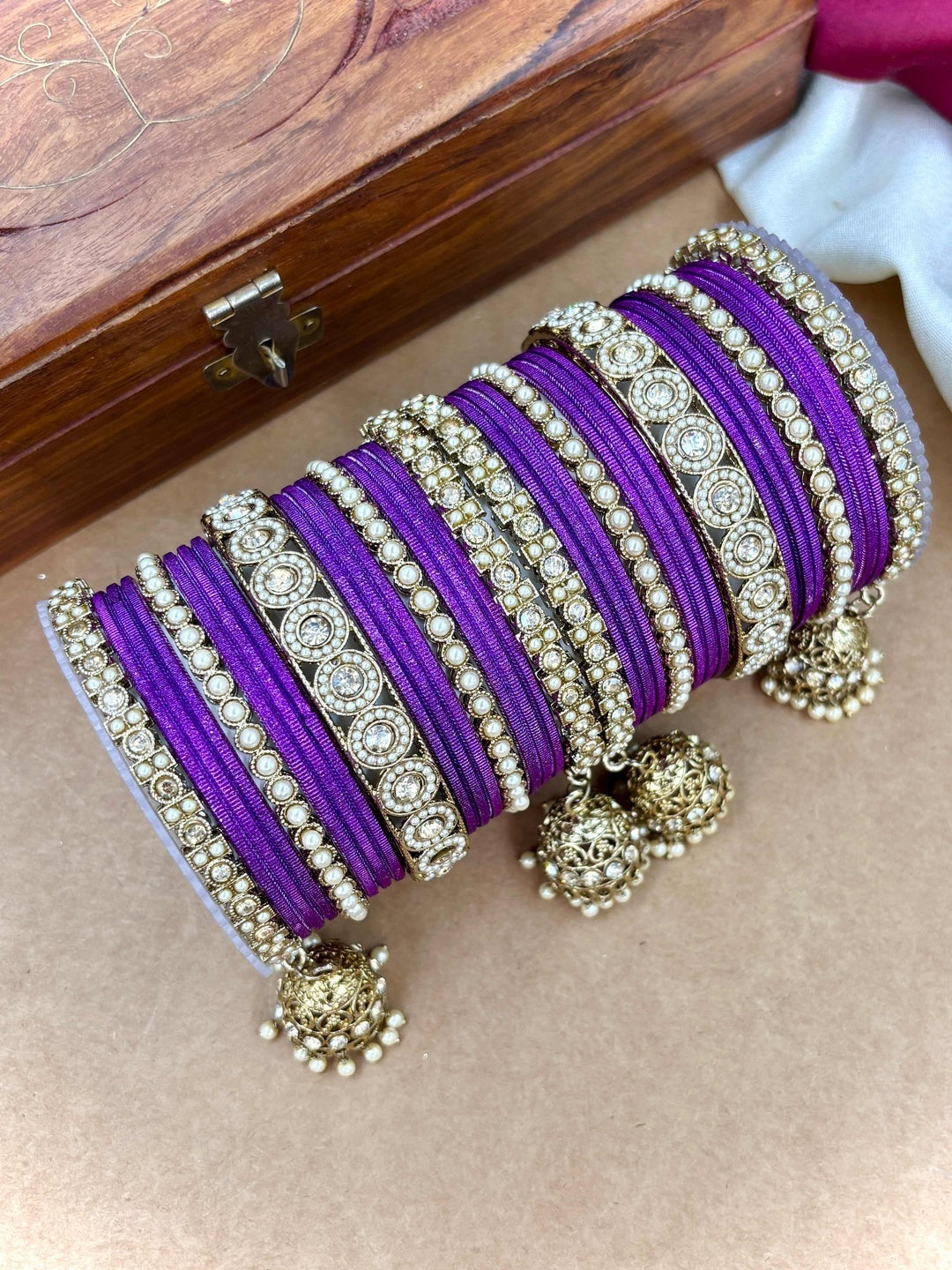 Ishhaara Pink Beaded Ethnic Bangle Set - A woman wearing a white top and pink beaded bangles - view 13