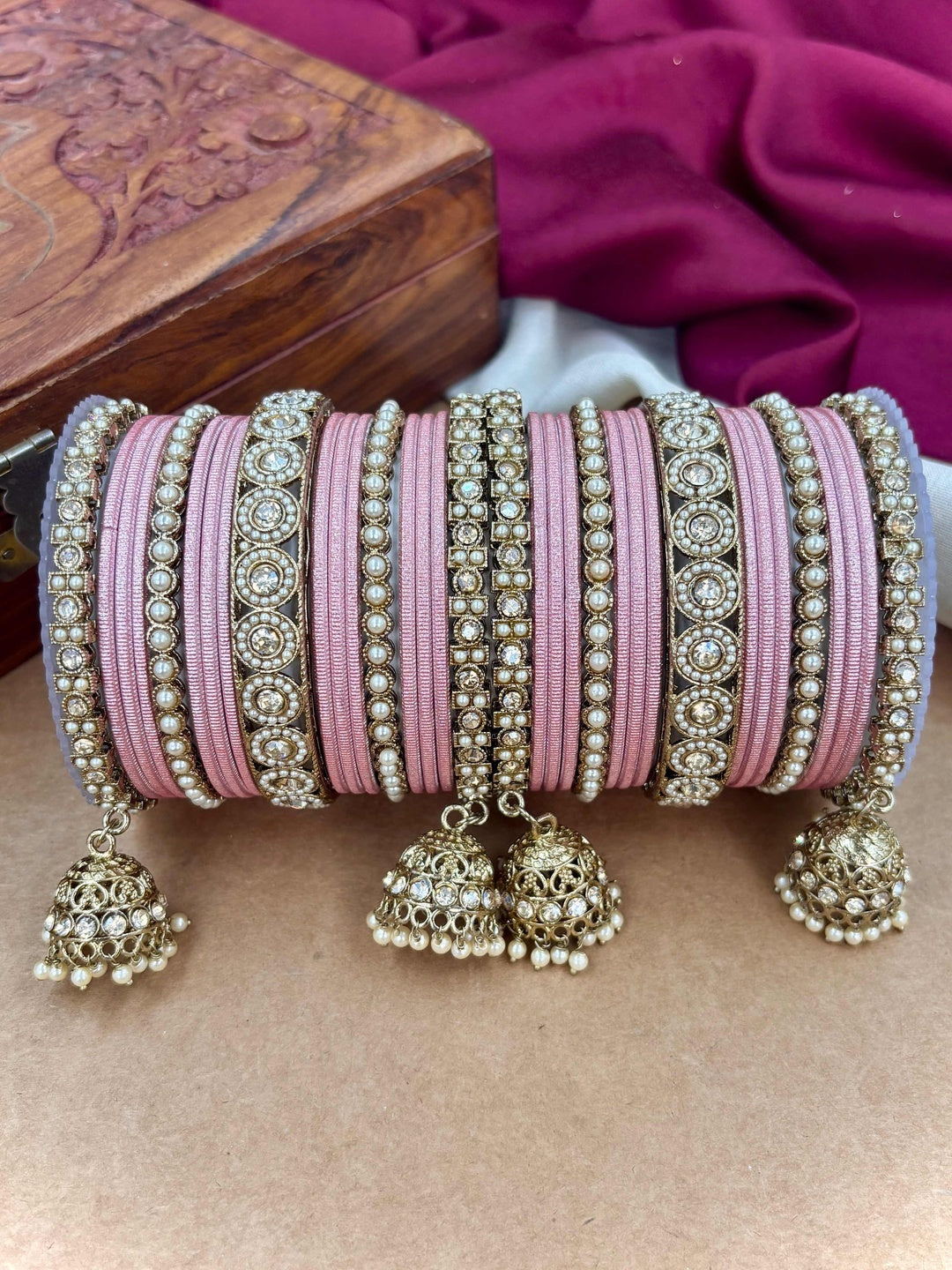 Ishhaara Pink Beaded Ethnic Bangle Set - A woman wearing a white top and pink beaded bangles - view 14
