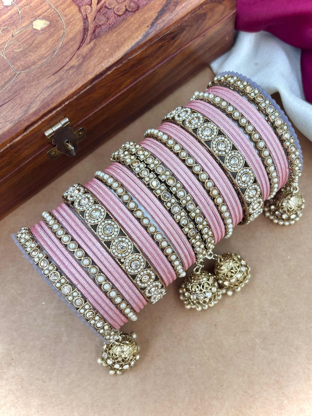 Ishhaara Pink Beaded Ethnic Bangle Set - A woman wearing a white top and pink beaded bangles - view 15