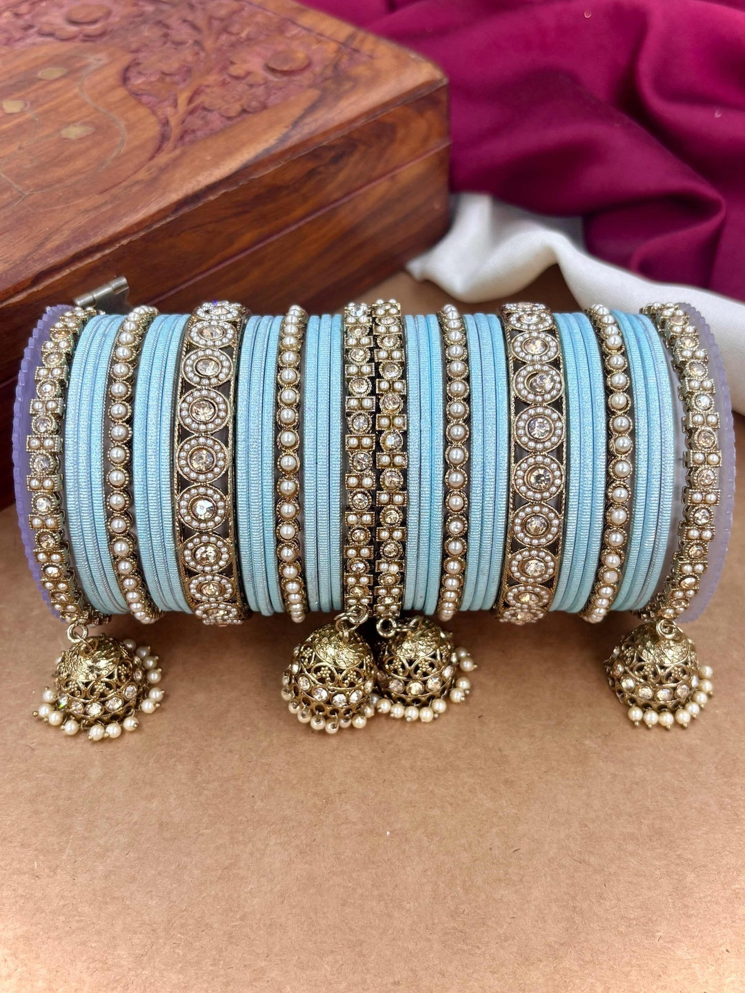 Ishhaara Pink Beaded Ethnic Bangle Set - A woman wearing a white top and pink beaded bangles - view 25