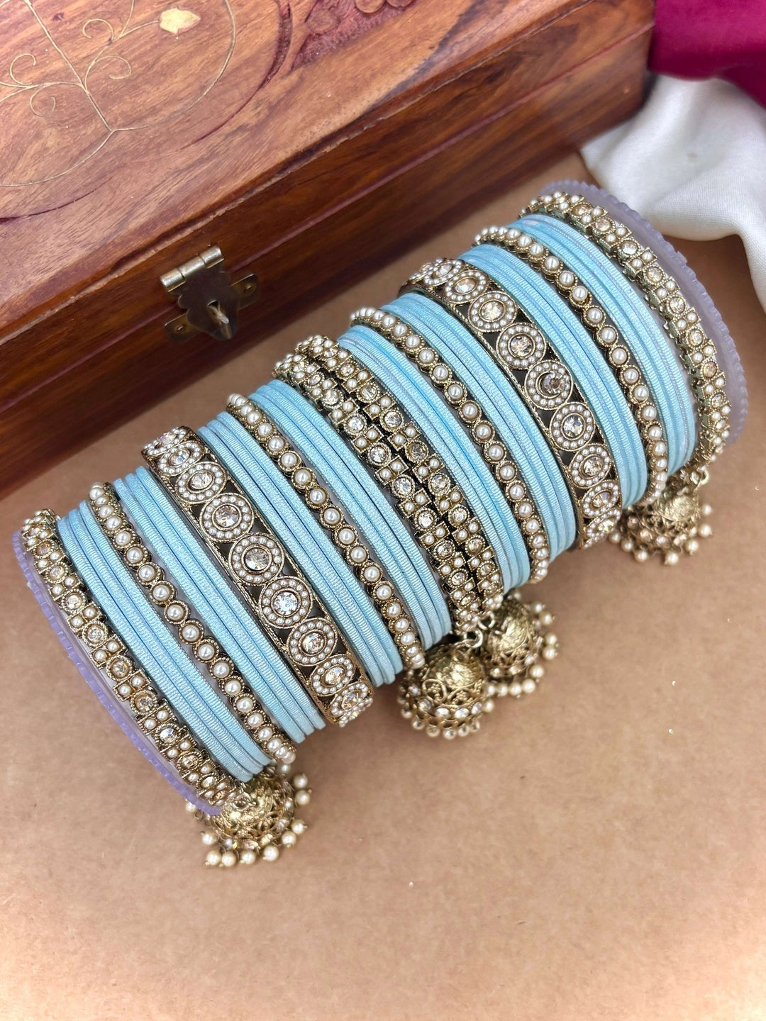 Ishhaara Pink Beaded Ethnic Bangle Set - A woman wearing a white top and pink beaded bangles - view 29