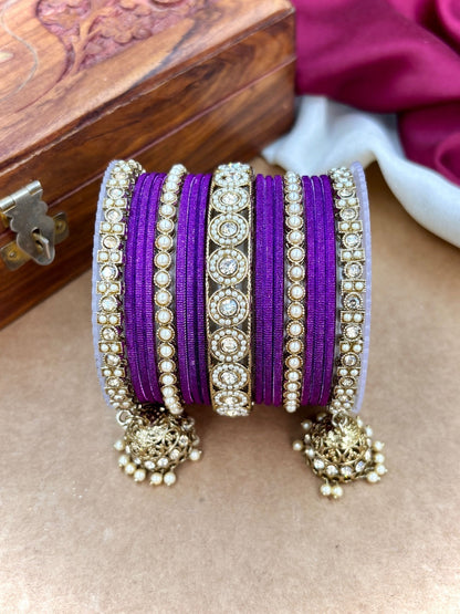 Ishhaara Pink Beaded Ethnic Bangle Set - A woman wearing a white top and pink beaded bangles - view 3