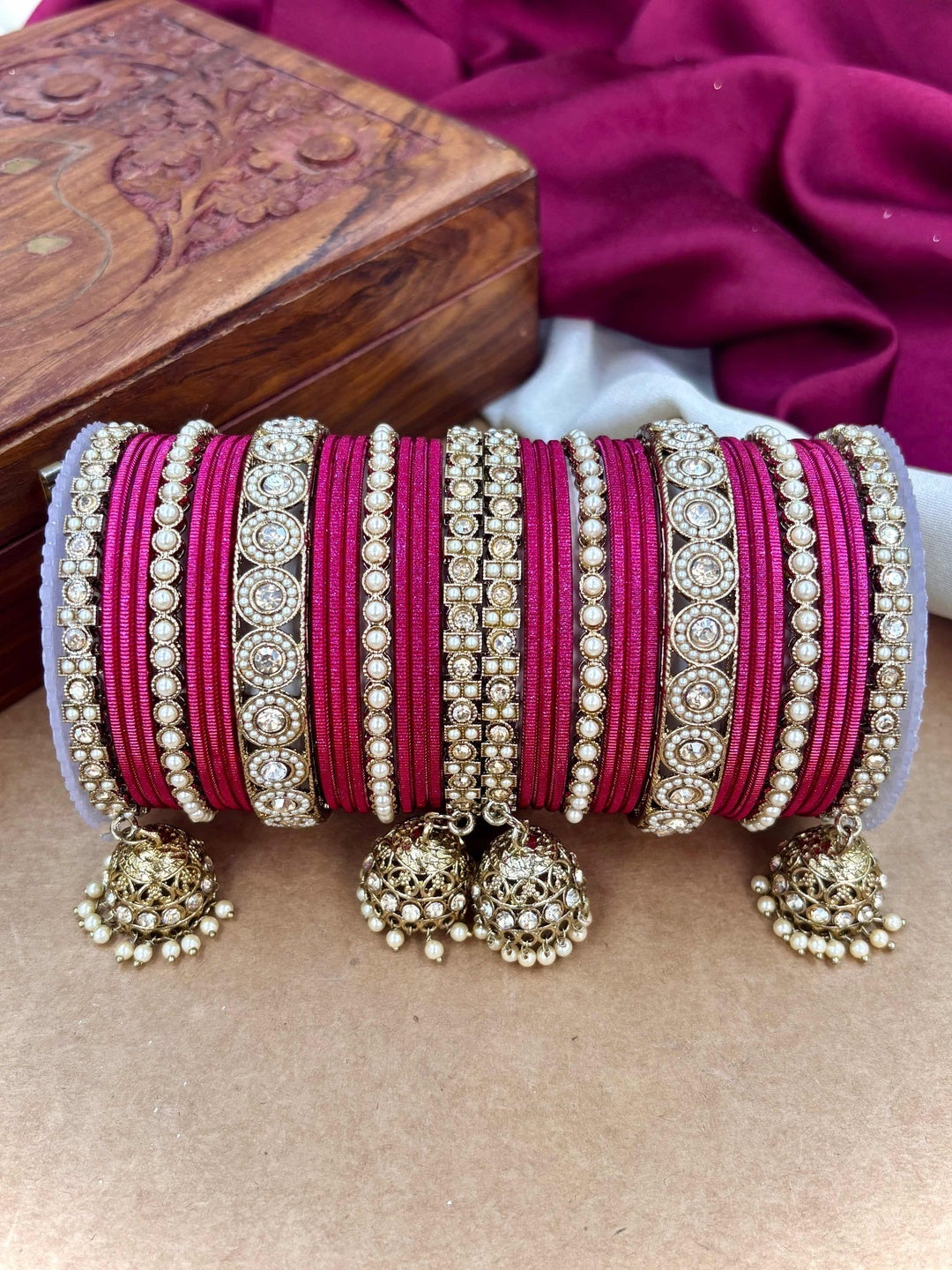 Ishhaara Pink Beaded Ethnic Bangle Set - A woman wearing a white top and pink beaded bangles - view 33