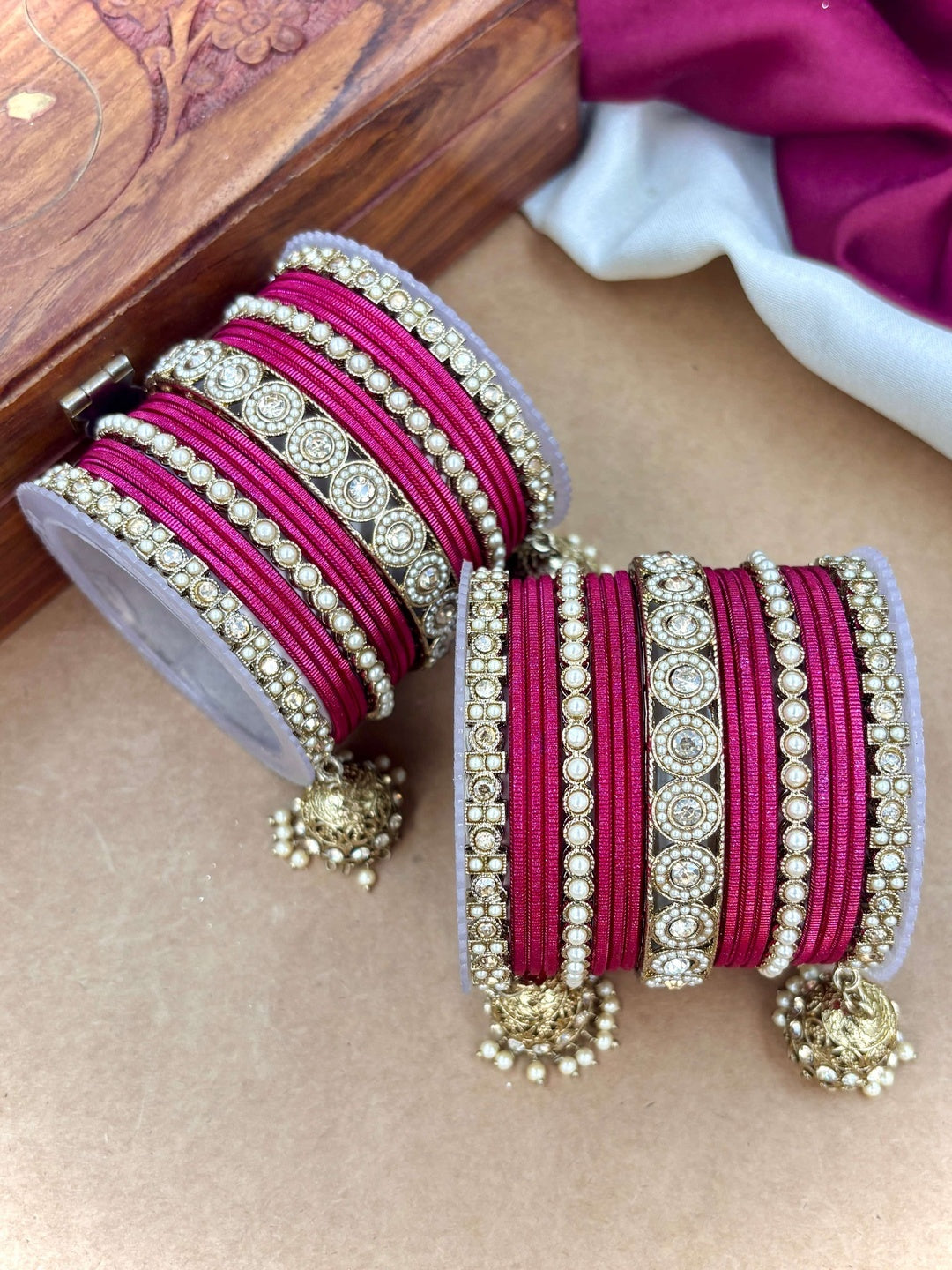 Ishhaara Pink Beaded Ethnic Bangle Set - A woman wearing a white top and pink beaded bangles - view 34