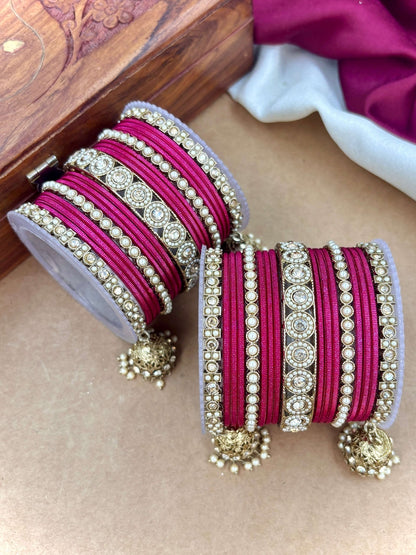 Ishhaara Pink Beaded Ethnic Bangle Set - A woman wearing a white top and pink beaded bangles - view 34