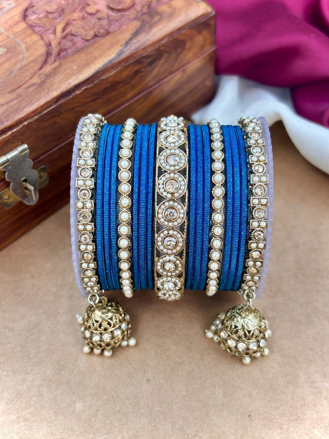 Ishhaara Pink Beaded Ethnic Bangle Set - A woman wearing a white top and pink beaded bangles - view 5