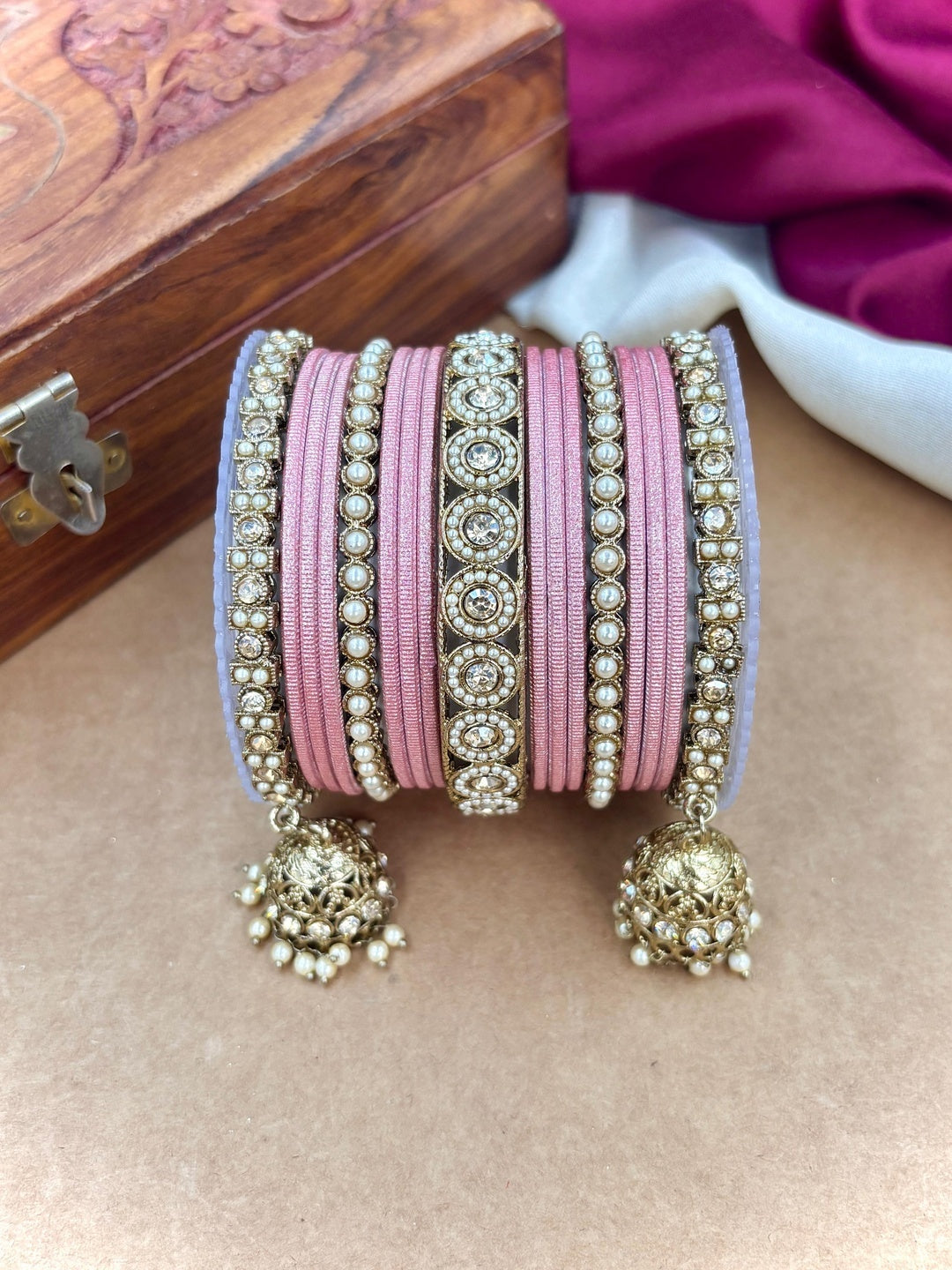 Ishhaara Pink Beaded Ethnic Bangle Set - A woman wearing a white top and pink beaded bangles - view 8