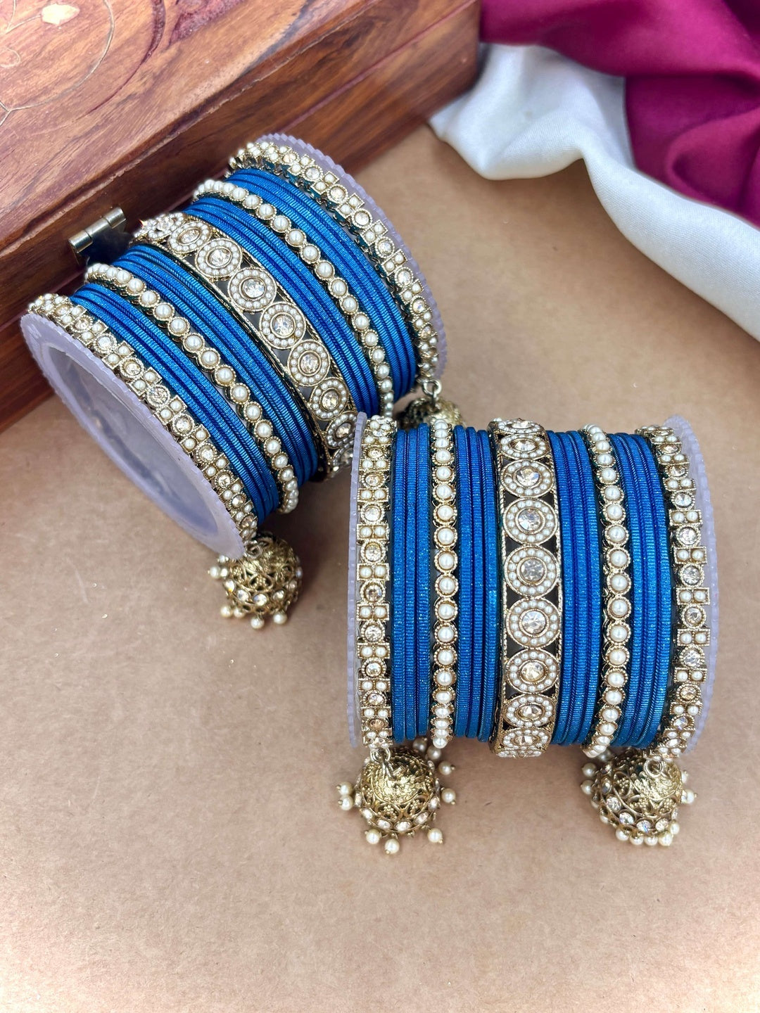 Ishhaara Pink Beaded Ethnic Bangle Set - A woman wearing a white top and pink beaded bangles - view 9