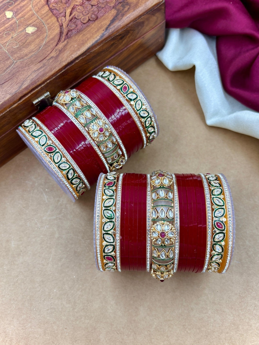 Ishhaara Red Kundan Bangle Set - a stack of red and gold bangles with intricate designs - view 2