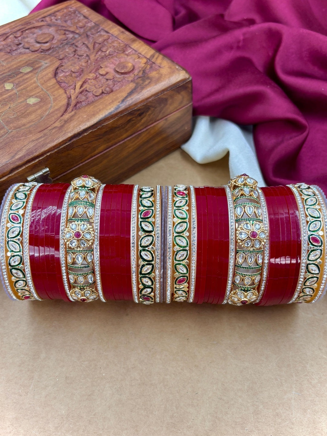 Ishhaara Red Kundan Bangle Set - a stack of red and gold bangles with intricate designs - view 5