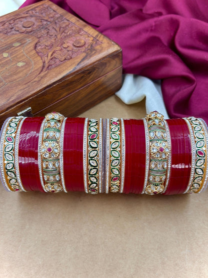 Ishhaara Red Kundan Bangle Set - a stack of red and gold bangles with intricate designs - view 5