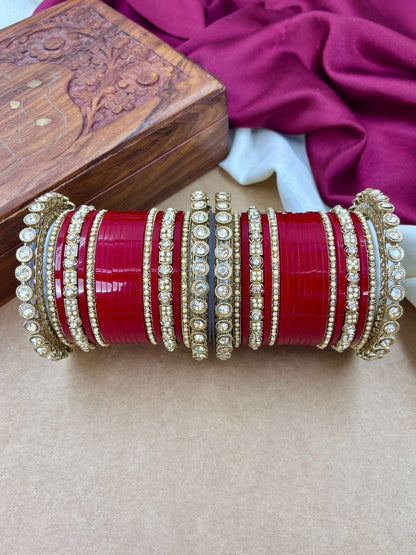 Ishhaara Red Kundan Bangle Set - a collection of red and gold bangles with intricate designs and stones
