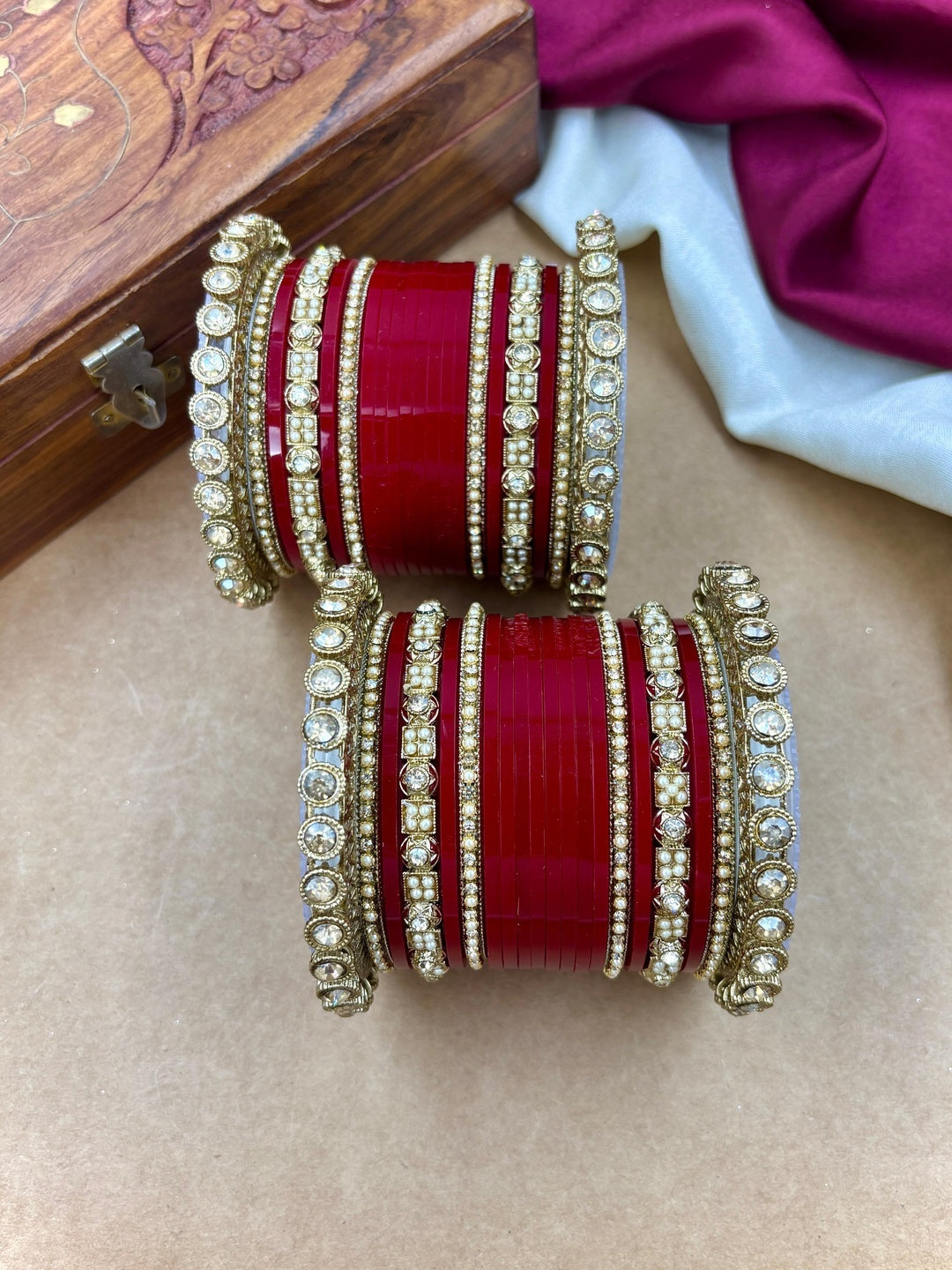 Ishhaara Red Kundan Bangle Set - a collection of red and gold bangles with intricate designs and stones - view 2