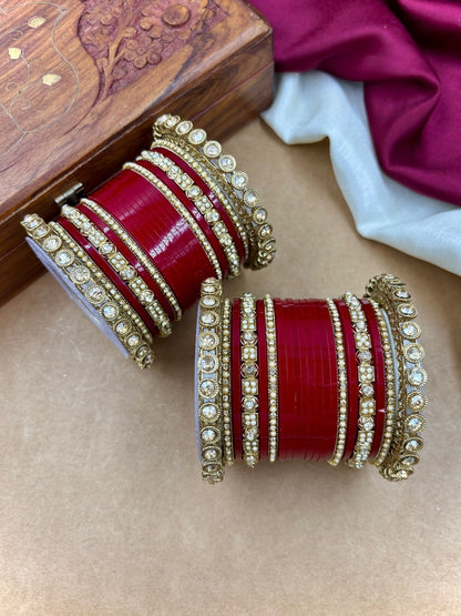 Ishhaara Red Kundan Bangle Set - a collection of red and gold bangles with intricate designs and stones - view 3