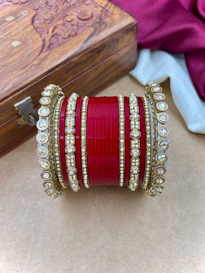 Ishhaara Red Kundan Bangle Set - a collection of red and gold bangles with intricate designs and stones - view 4