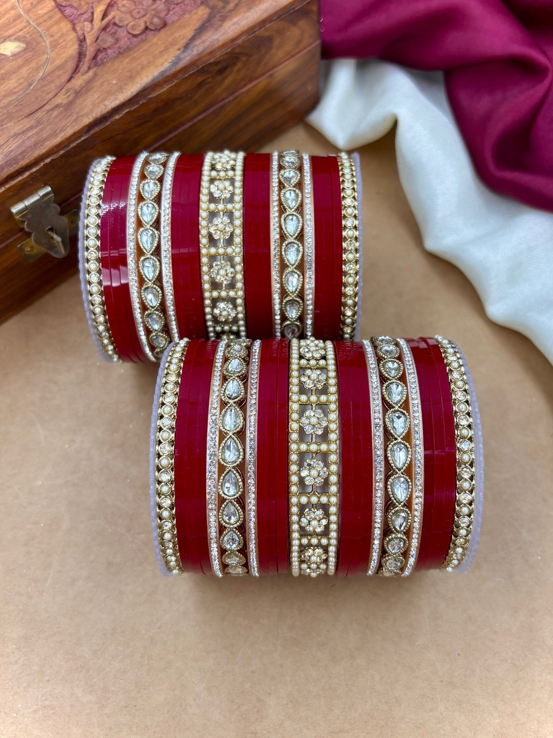 Ishhaara Red Kundan Bangle Set - a stunning collection of red bangles with intricate designs and high-quality stones
