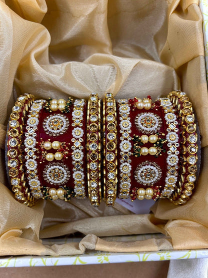Ishhaara Red Kundan Bangle Set - a stack of intricately designed red and gold bangles - view 2