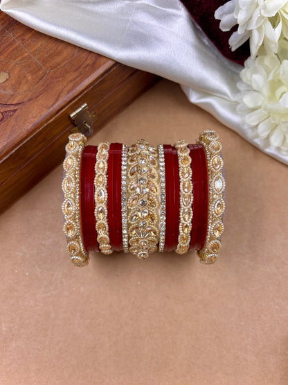 Ishhaara Red Kundan Bangle Set - a stack of red and gold bangles with intricate designs
