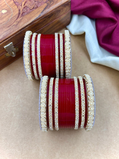 Ishhaara Red Kundan Bangles Set CM-HB51 - A pair of intricately designed red bangles with stone-studded detailing