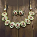 Ishhaara Red Oval Cut Kundan Necklace And Earring Set