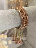 Ishhaara Rose Gold Antique Gold Stone Bangles With Latkan