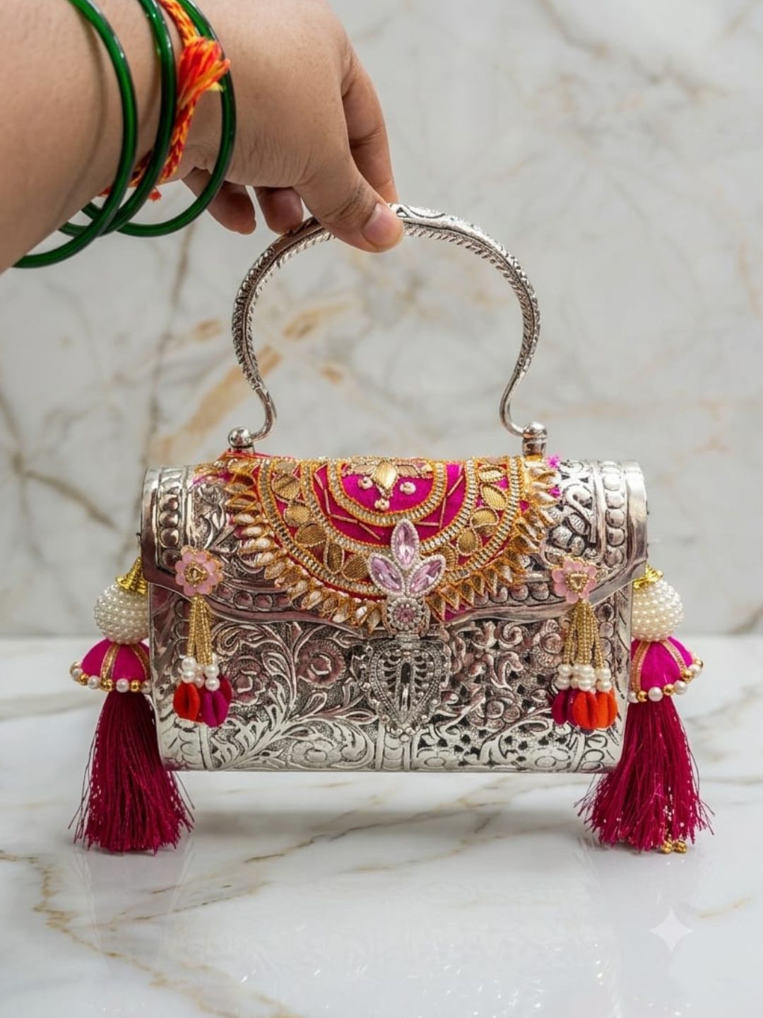 Ishhaara Silver And Gold Embossed Metal Bag