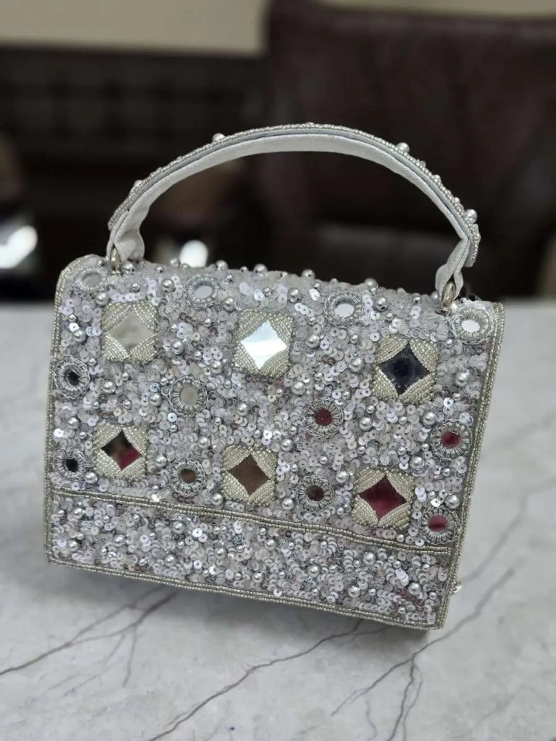 ishhaara mirror silver clutch bag
