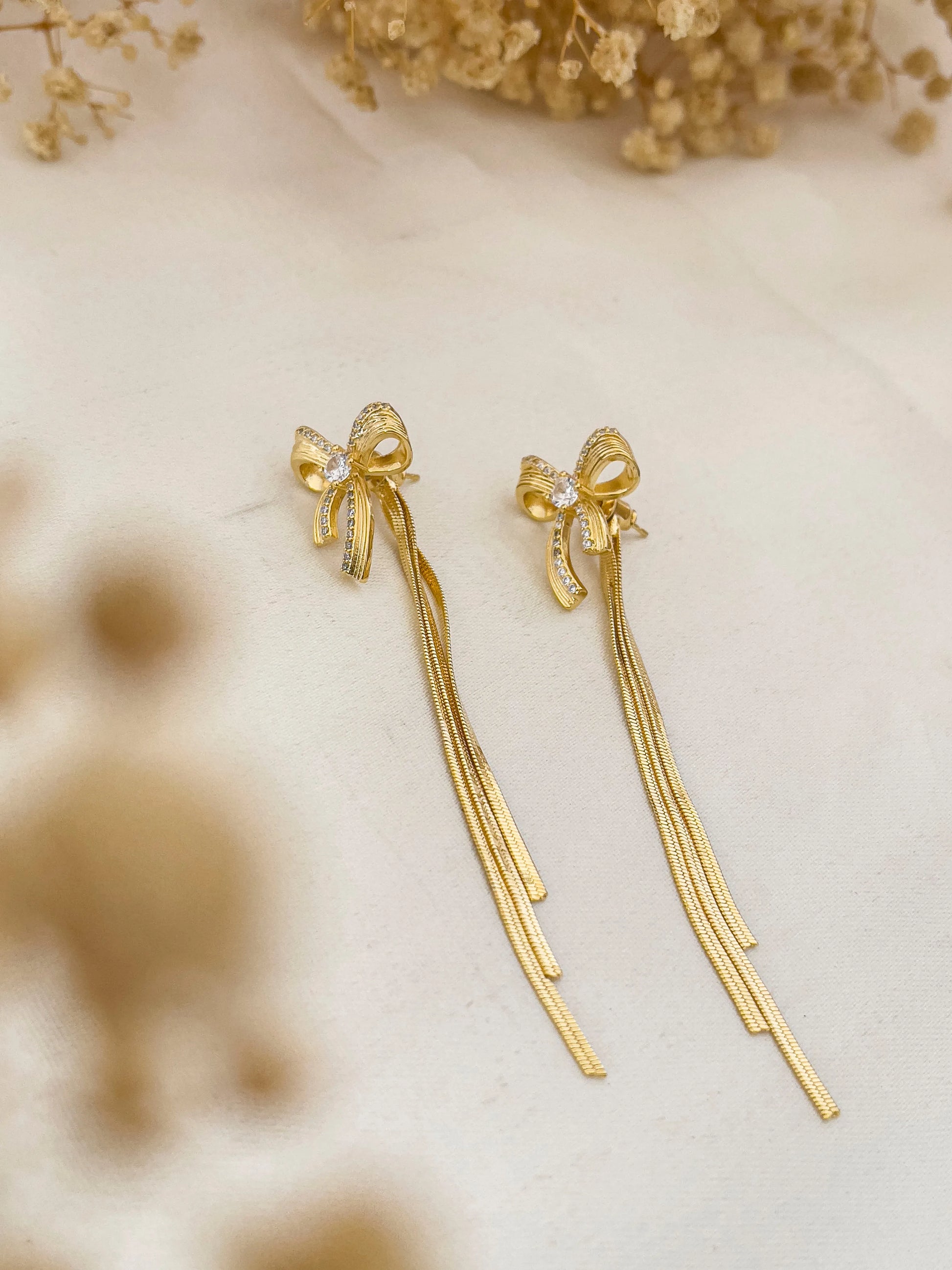 Ishhaara Stainless Steel Gold Long Bow Earrings