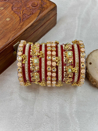 Ishhaara Traditional Gold Kundan Bangles Set - a stack of intricately designed red and gold bangles with elephant motifs - view 6