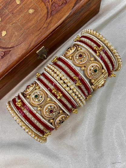 Ishhaara Traditional Kundan Bangle Bracelet Set - Close-up of a woman's hands adorned with red and gold bangles - view 9