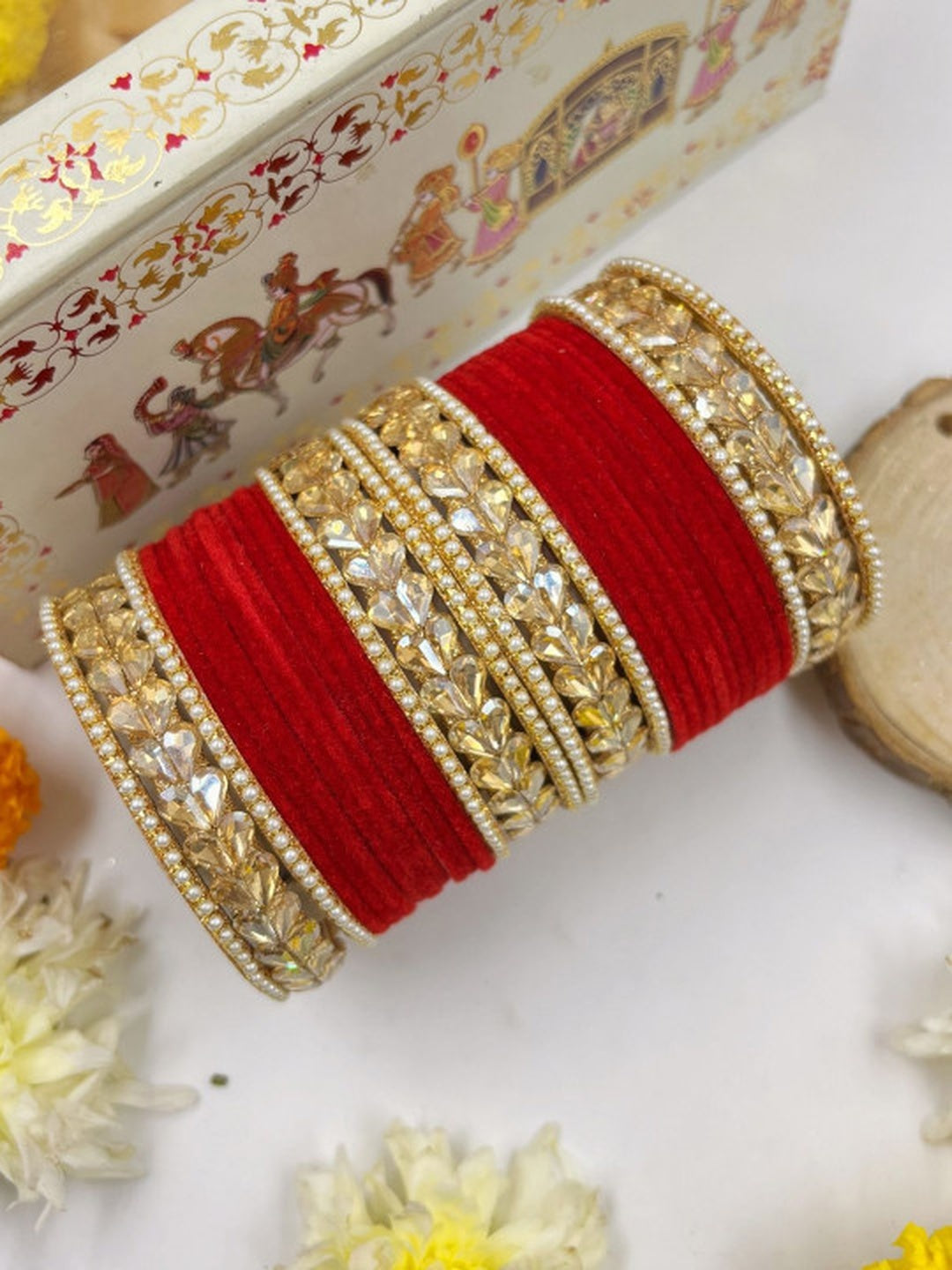 Ishhaara Traditional Red Kundan Bangle Set - a stack of red velvet and gold bangles adorned with Kundan stones