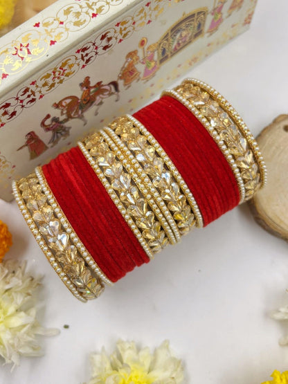Ishhaara Traditional Red Kundan Bangle Set - a stack of red velvet and gold bangles adorned with Kundan stones