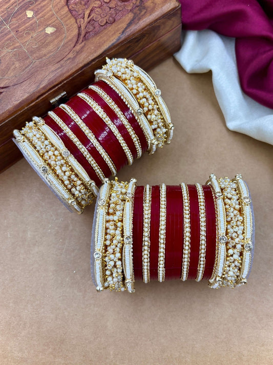 Ishhaara Traditional Red Kundan Bangle Set - a pair of intricately designed red bangles with gold and pearl embellishments