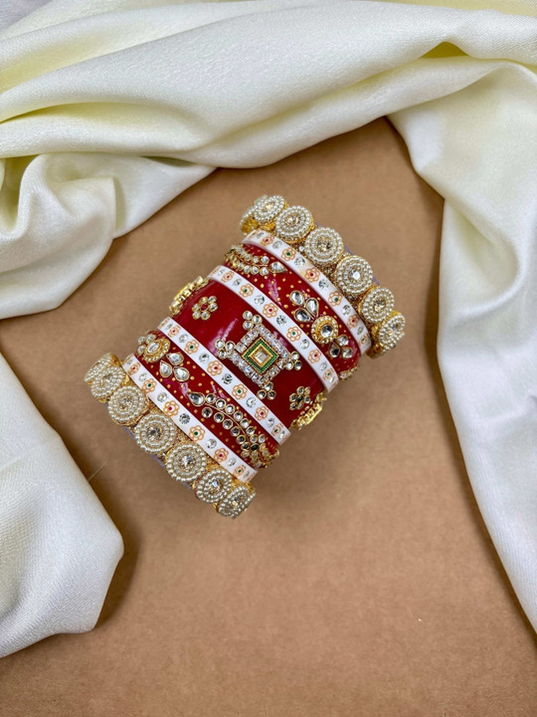 Ishhaara Traditional Red Kundan Bangles - A pair of intricately designed red bangles with gold and white accents - view 3