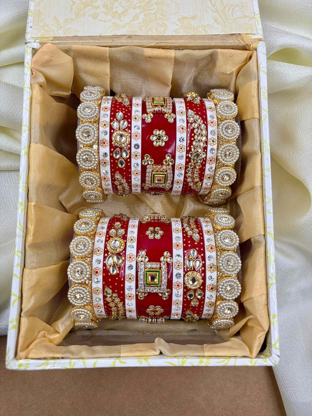 Ishhaara Traditional Red Kundan Bangles - A pair of intricately designed red bangles with gold and white accents - view 5