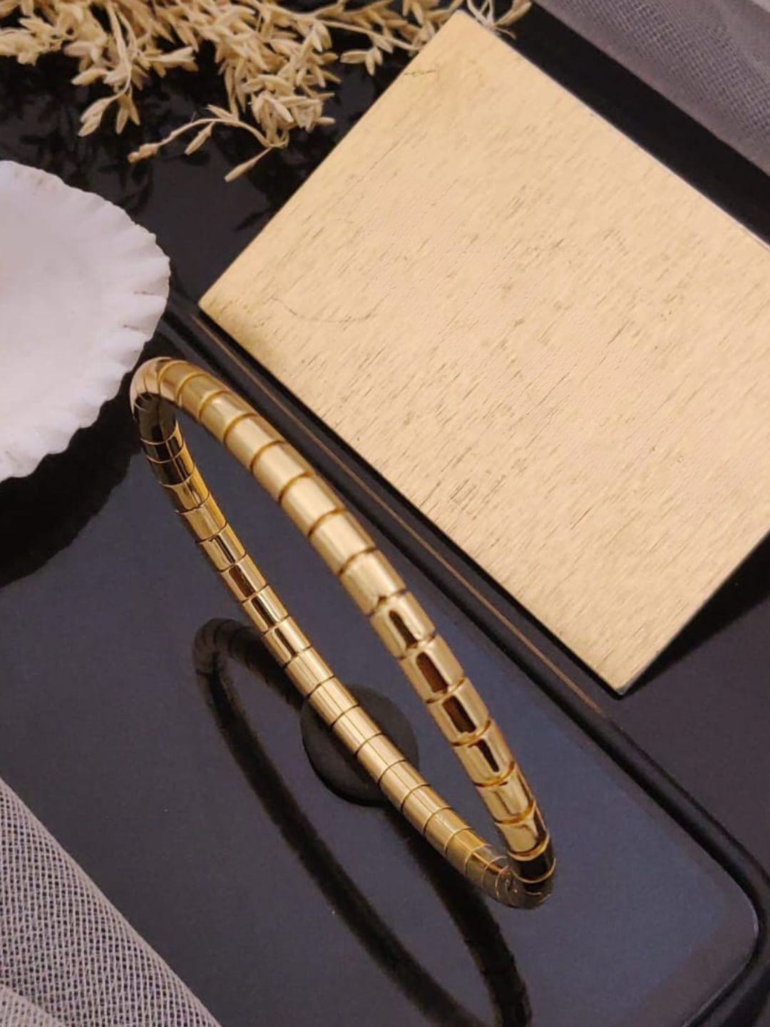 Ishhaara Trendy Braided Gold Toned Kada